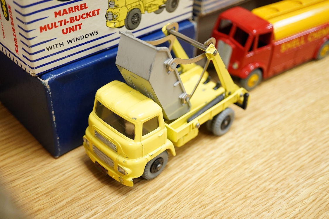 Five boxed Dinky Toys and Supertoys; Bedford Articulated Lorry in yellow (521), Leyland Cement Wagon (933), AEC tanker (991), Plymouth USA taxi (265) and Marrel Multi-Bucket Unit (966)